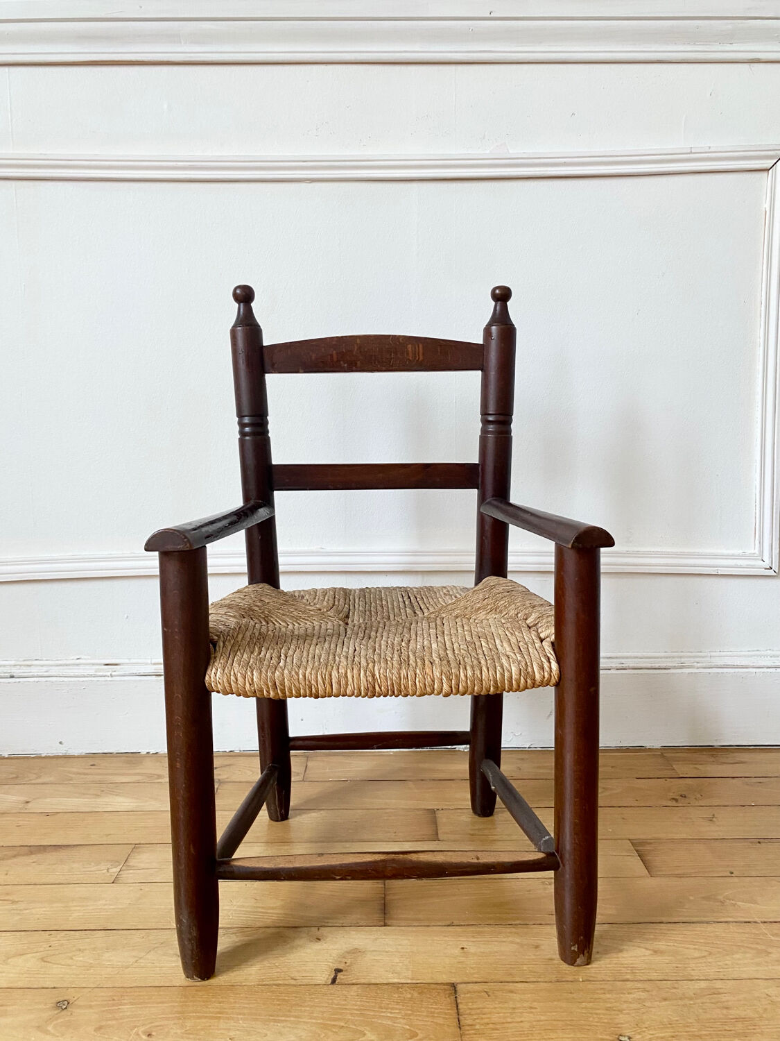 Wooden chair and children's straw