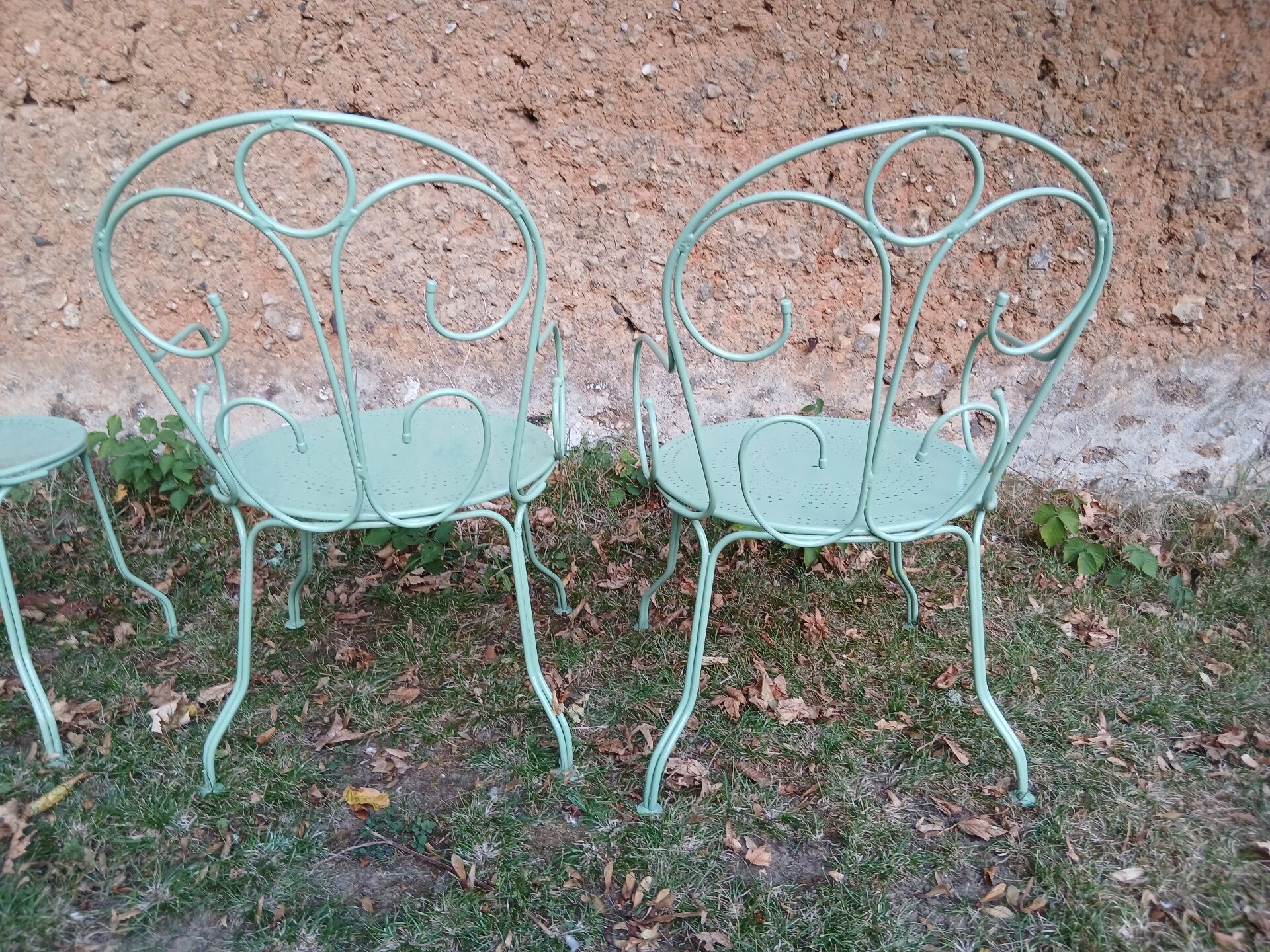 Garden furniture set with 1 table, 2 armchairs, and 2 chairs in antique green wrought iron.