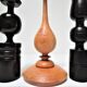 Three vintage light and dark wood candlesticks
