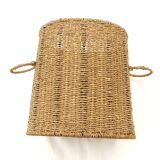 Braided straw wastepaper basket.