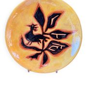Terracotta plate, Jean Lurçat decorated with a rooster and foliage.