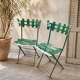 Pair of original patinated folding Parisian bistro chairs.