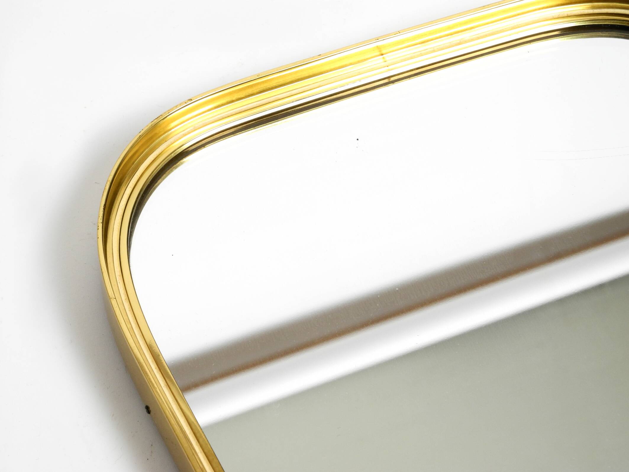 Small solid Mid Century brass wall mirror by Münchener Zierspiegel