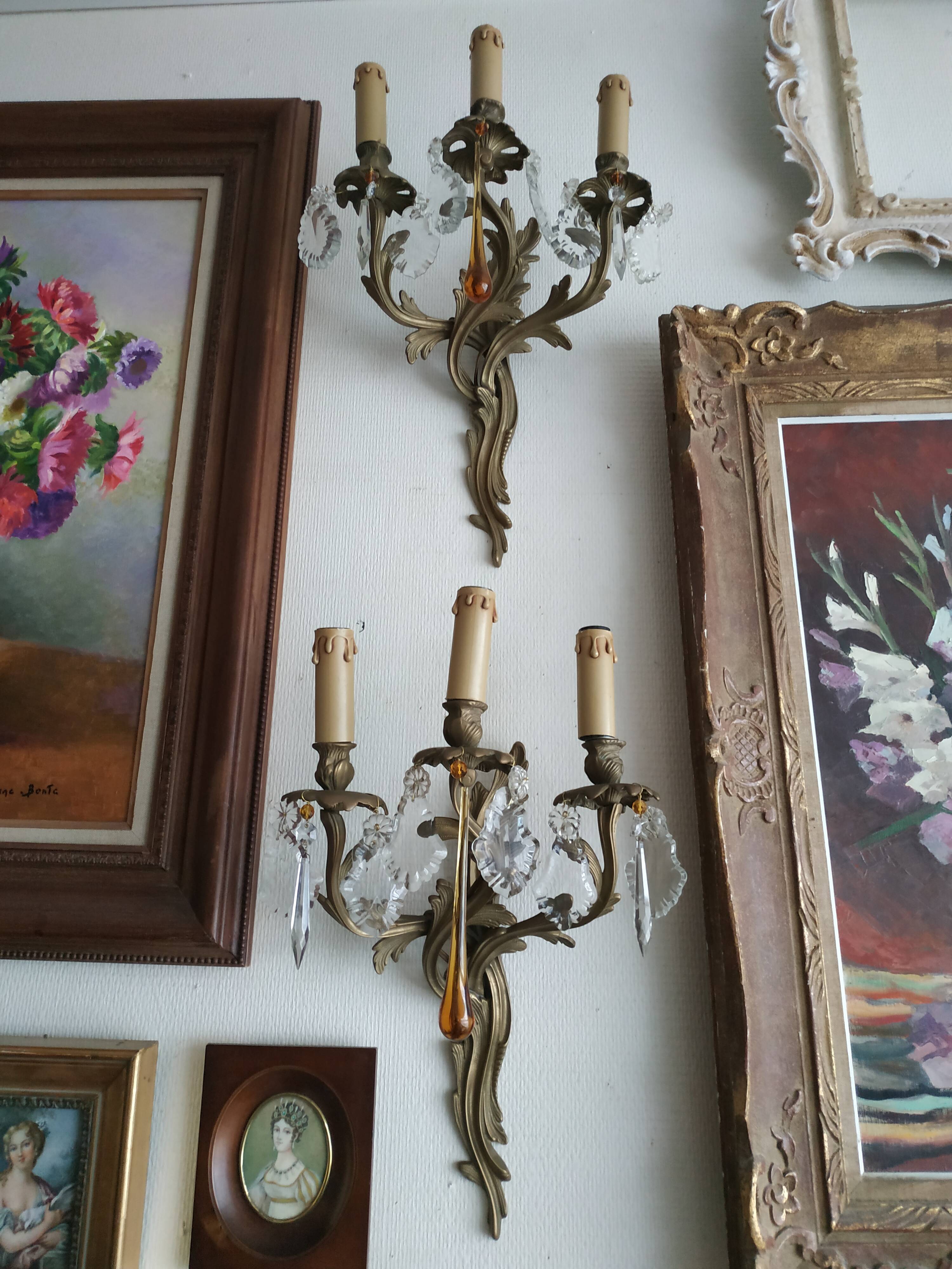 Pair of bronze and crystal sconces
