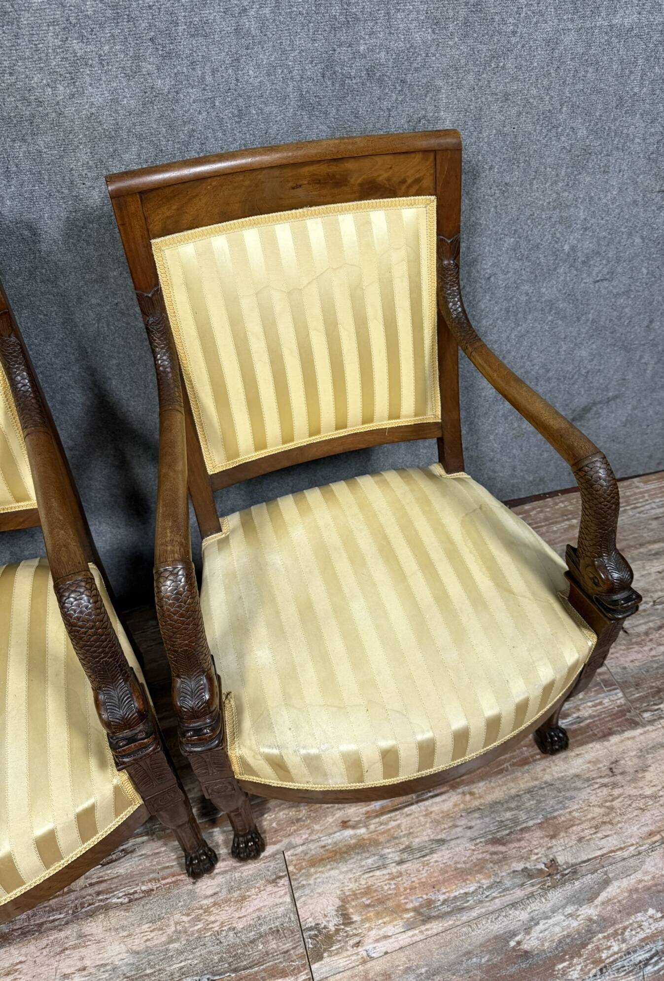 Pair of Empire period mahogany dolphin armchairs