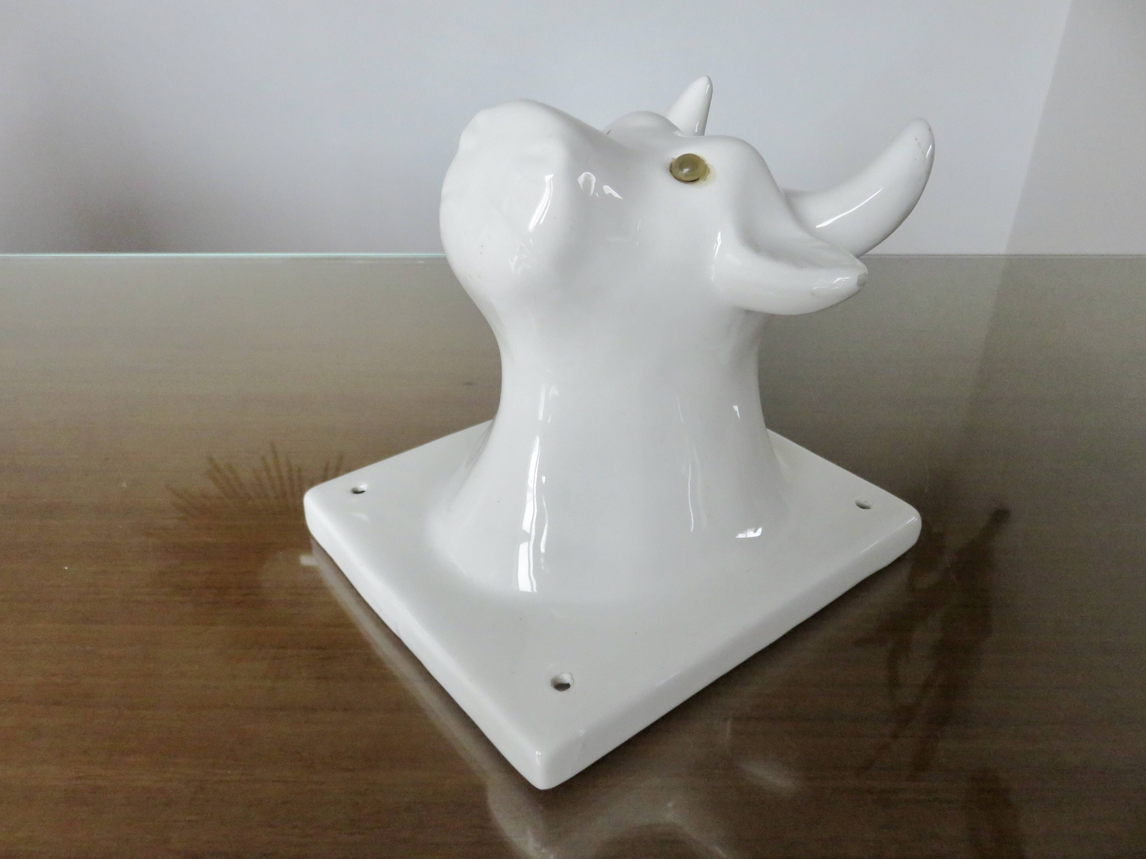 Stylized cow head in white ceramic, wall decoration from the 80s