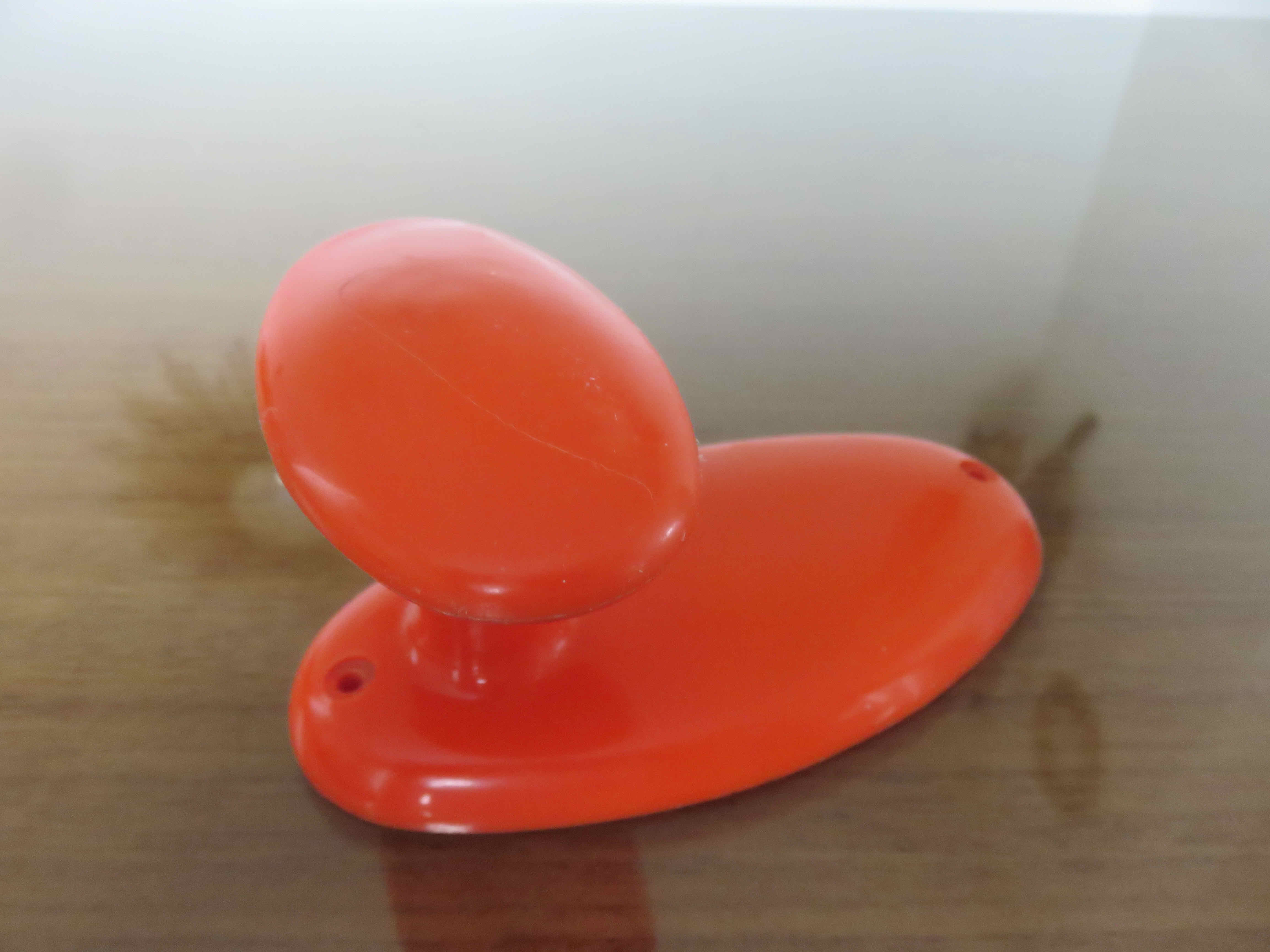 Orange plastic hook 70s