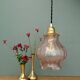 Suspension globe vintage en verre granité rose