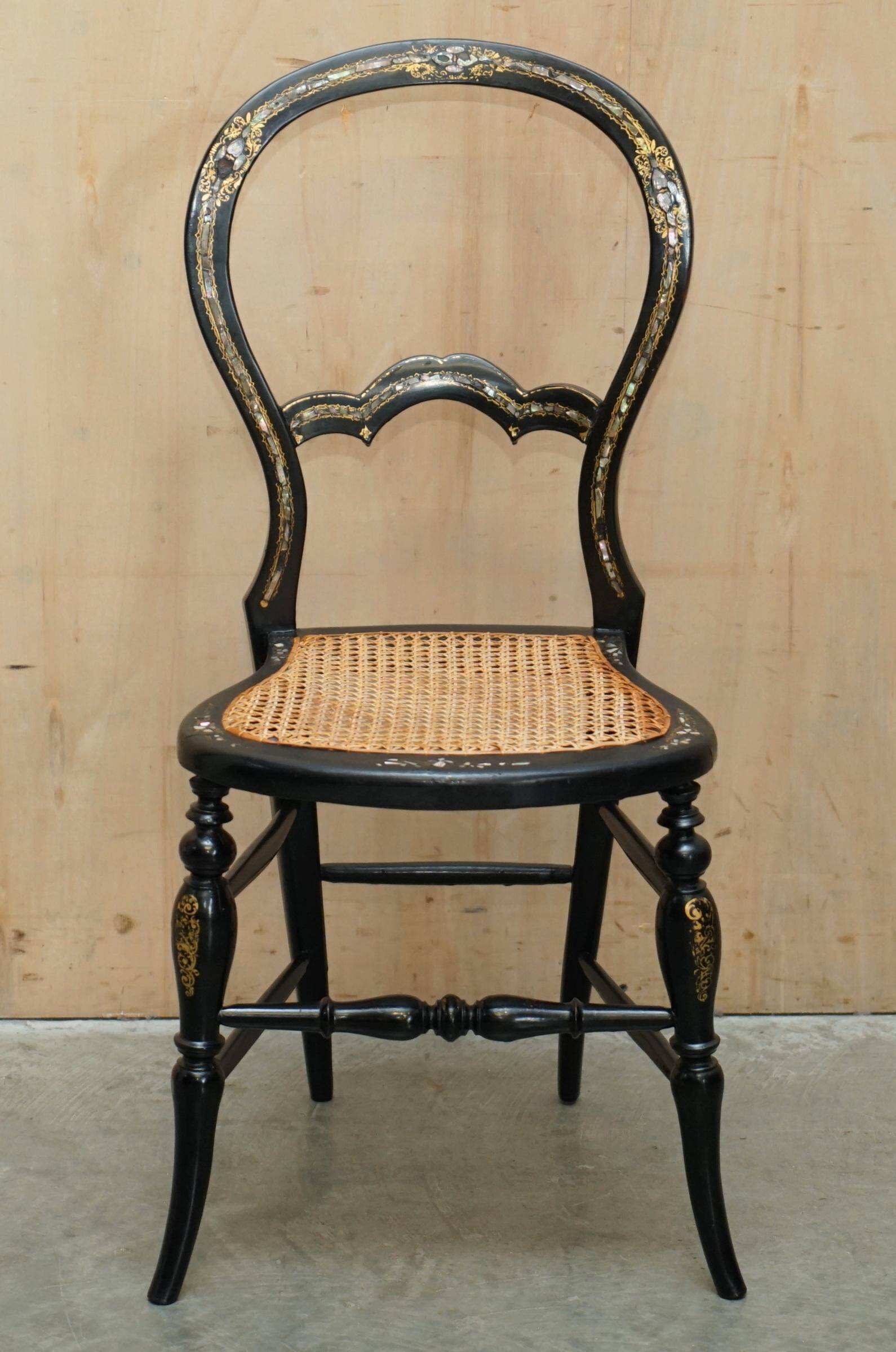 Four antique Regency bergère chairs with mother-of-pearl inlay.