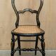 Four antique Regency bergère chairs with mother-of-pearl inlay.