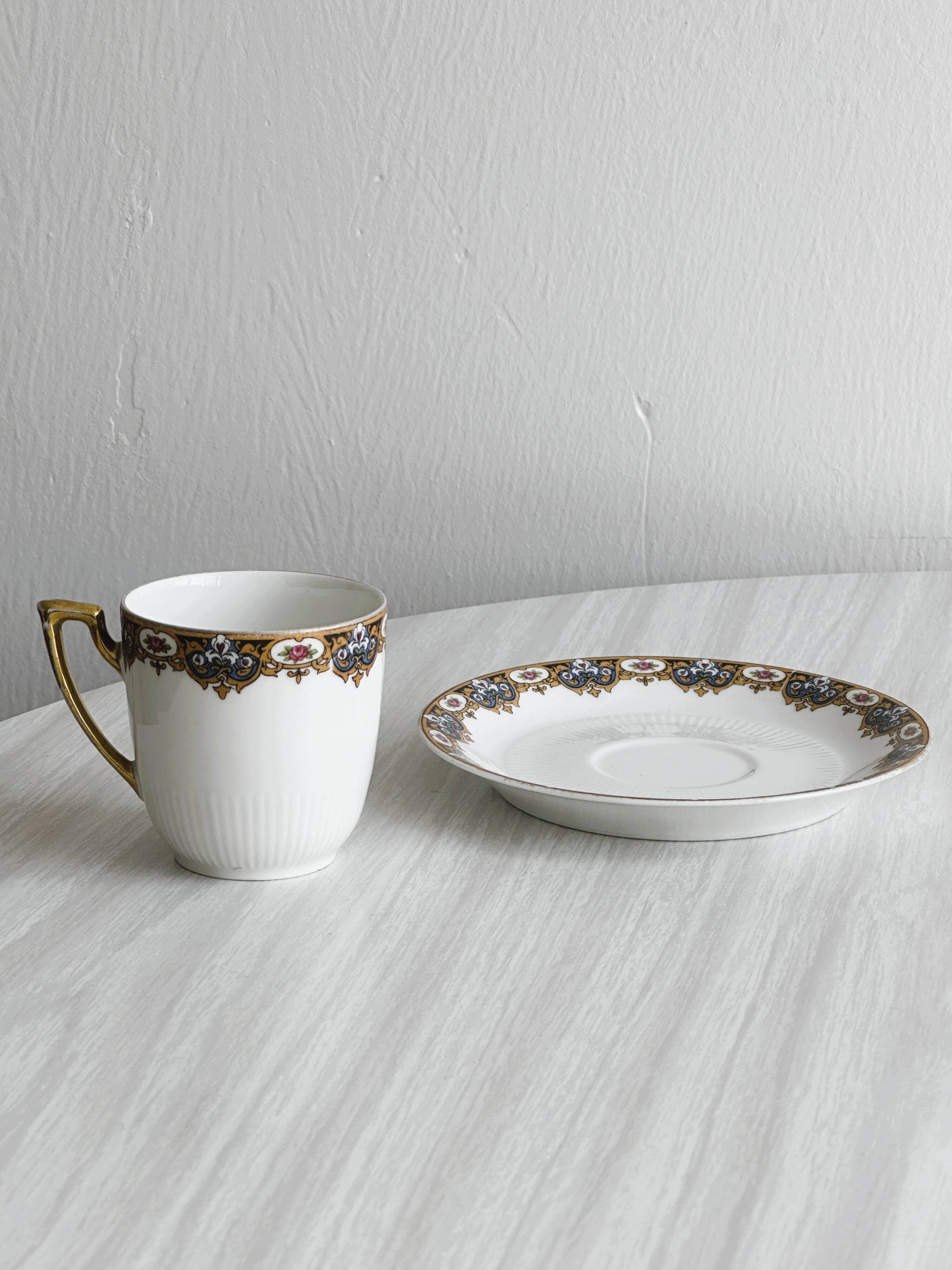 7 Limoges porcelain cups and saucers with gold decoration and floral motif.