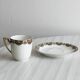 7 Limoges porcelain cups and saucers with gold decoration and floral motif.