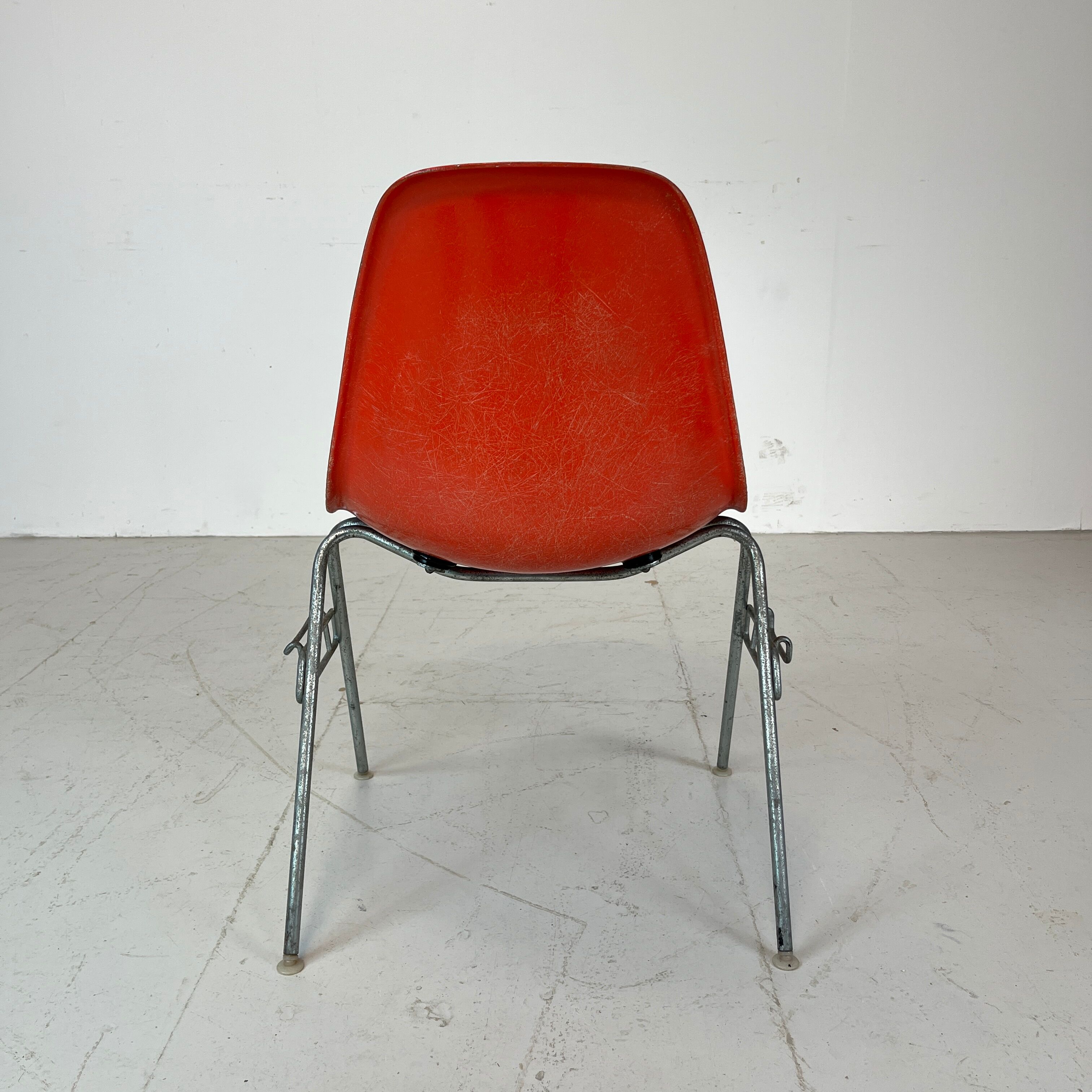 Vintage Eames Herman Miller DSS side chairs in coral orange