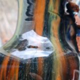 Terracotta vase with a child's head