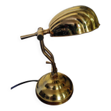 Articulated shell lamp in gold metal