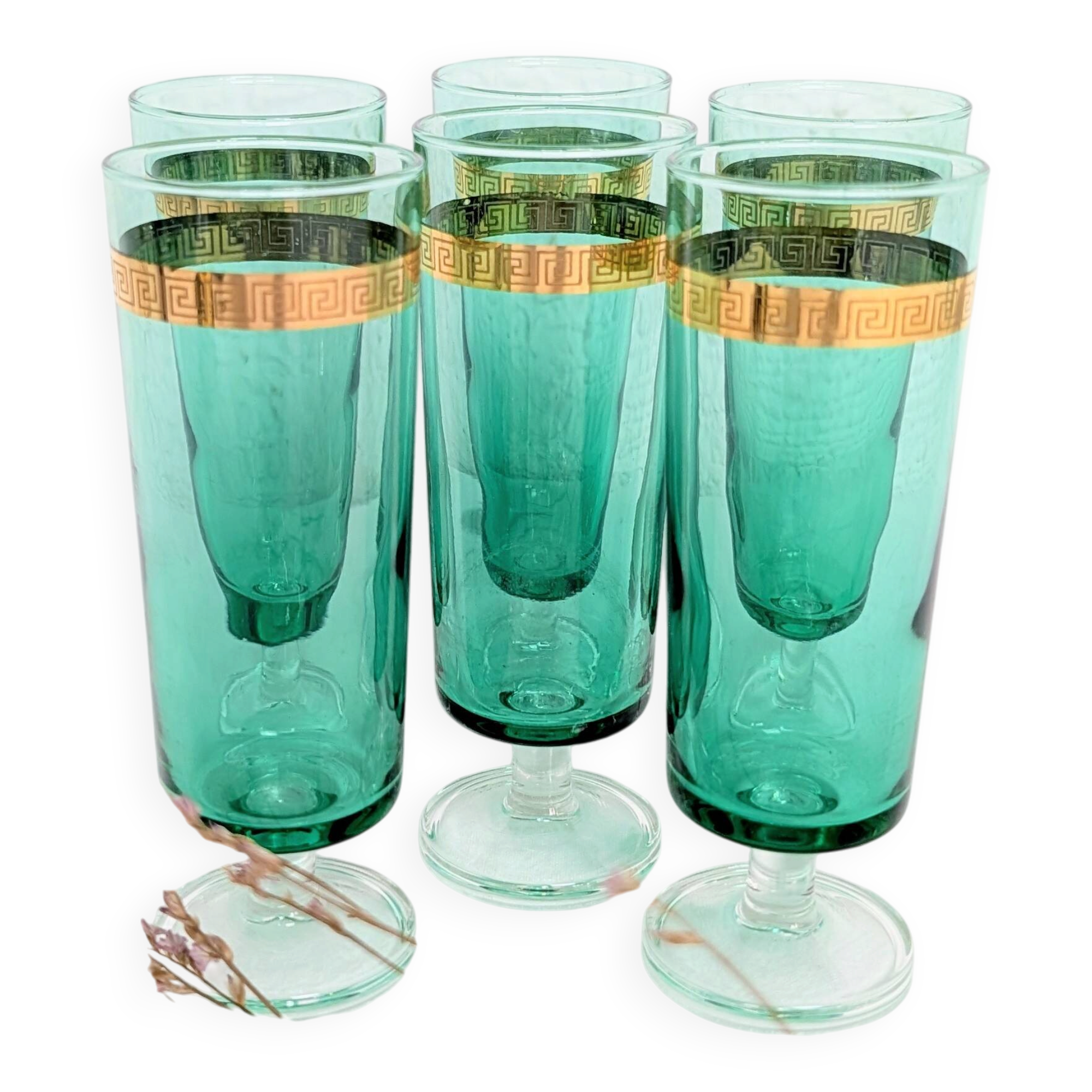 Set of 6 green champagne flutes with a golden rim.