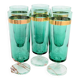 Set of 6 green champagne flutes with a golden rim.