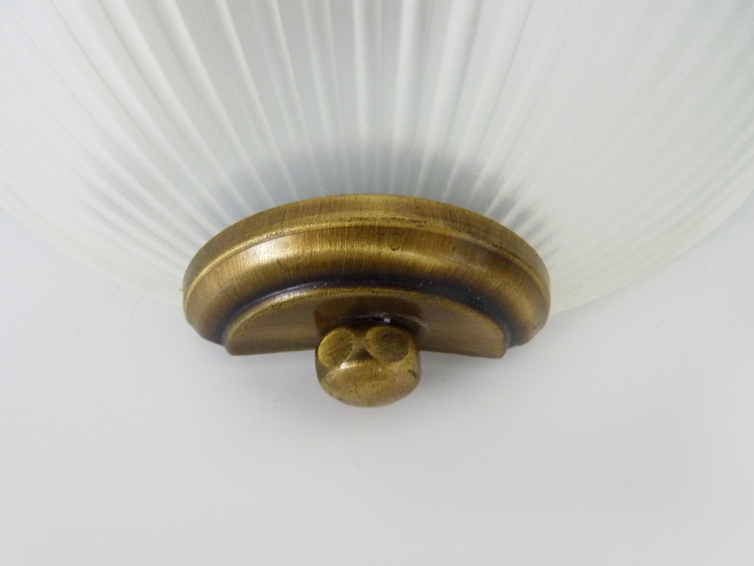 Pair of Mathias wall lamps in gilded metal and white shell-style glass