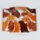 Handcrafted ceramic trinket dish in shades of brown and orange