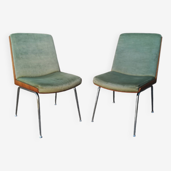 Shell chairs and green fabric