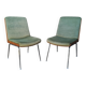 Shell chairs and green fabric
