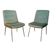 Shell chairs and green fabric