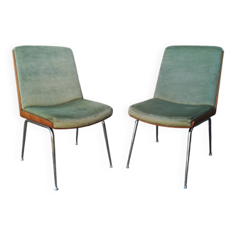 Shell chairs and green fabric