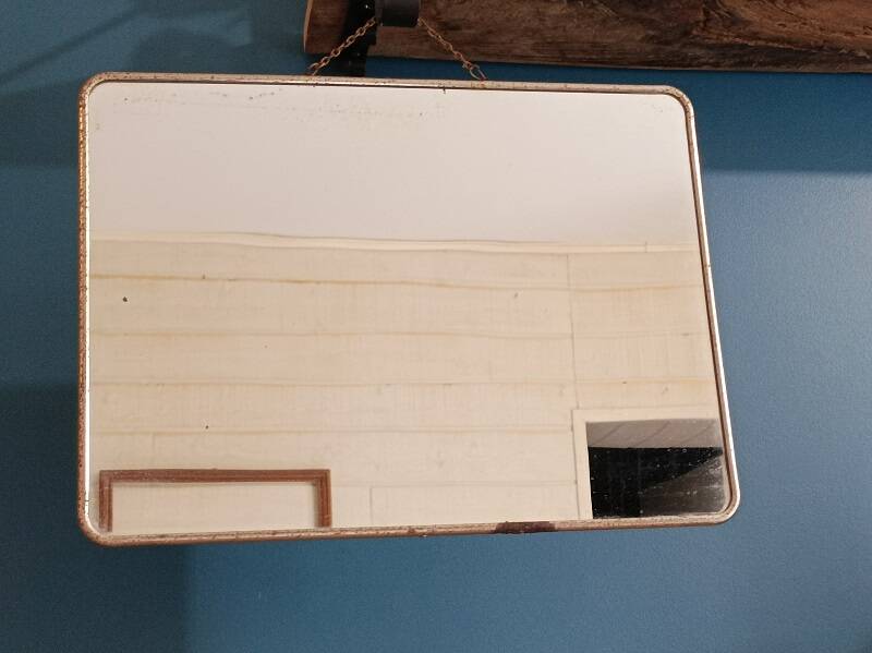 Barber mirror patinated metal surround