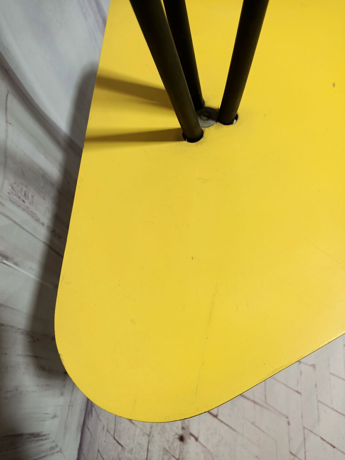 Mid-century tripod floor lamp with 3 lights and a yellow shelf.