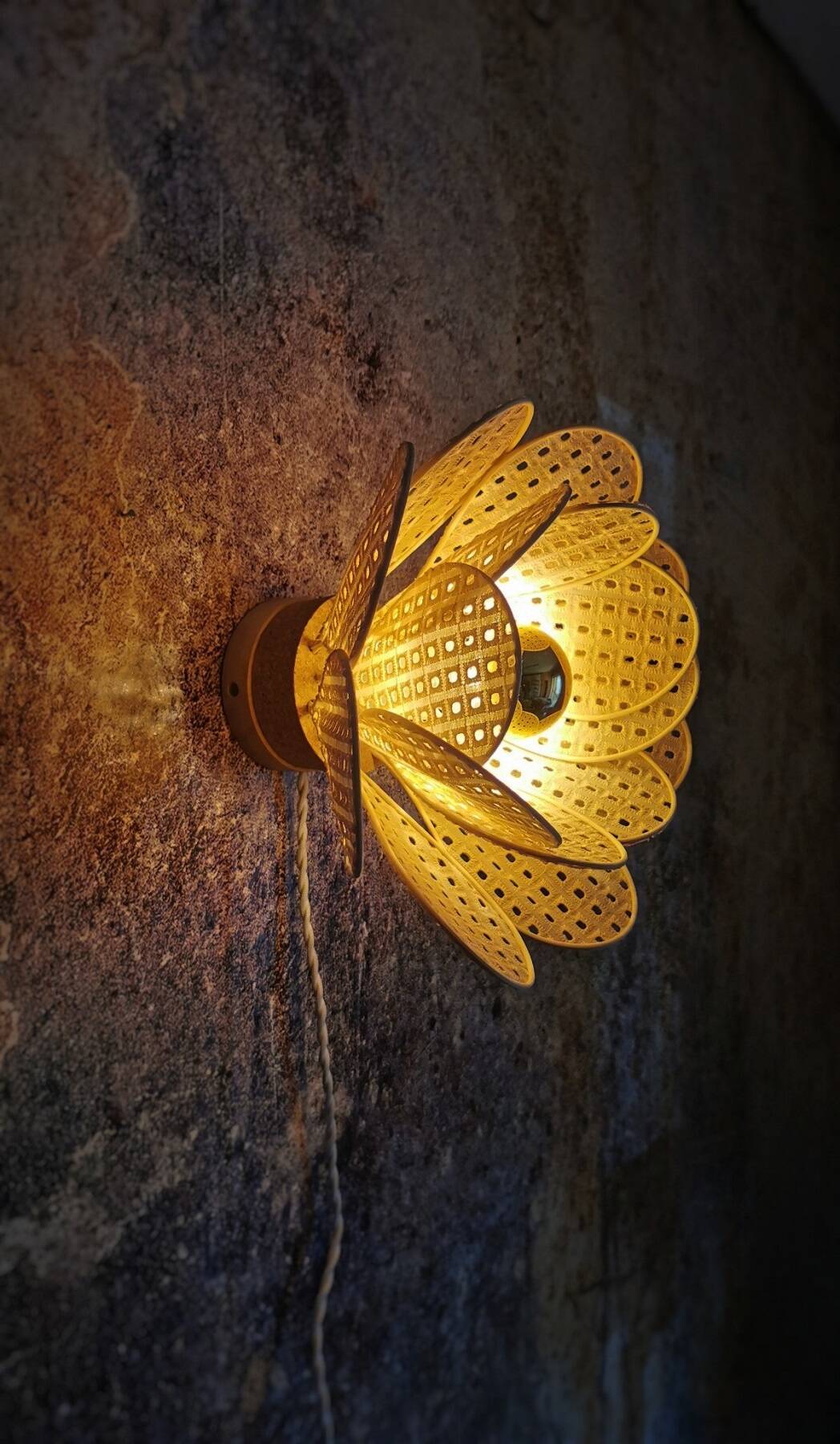 Flower wall light made of rattan petals and nude embroidery