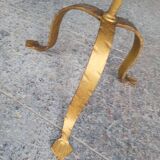 Minimalist brutalist gold metal pedestal table