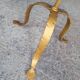 Minimalist brutalist gold metal pedestal table