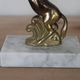 Pair of vintage bookends with rearing horses in gilded metal on marble bases.