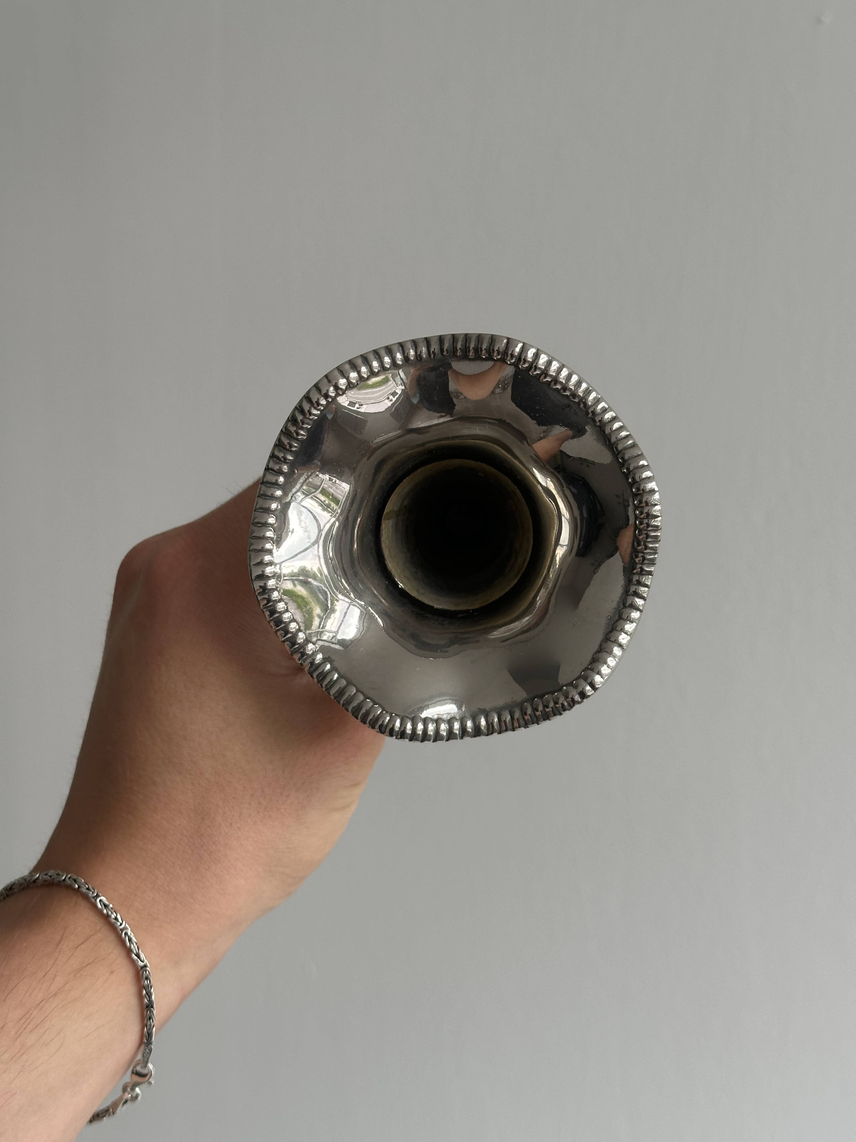 Small silver metal vase