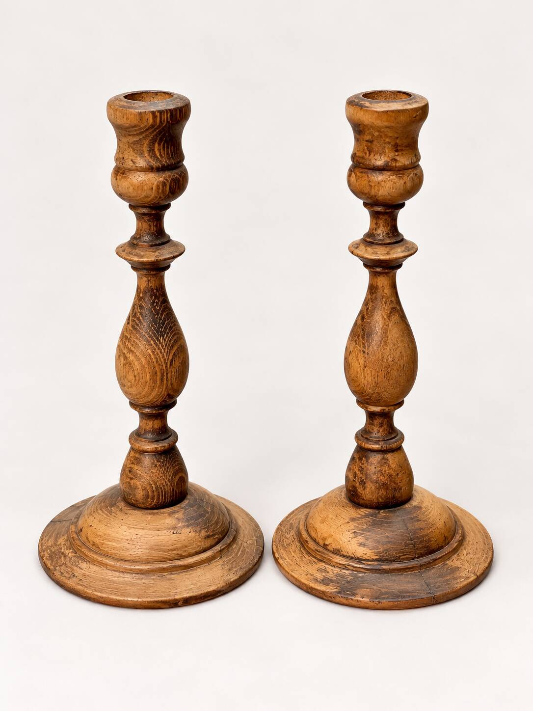 Pair of antique turned wooden candlesticks
