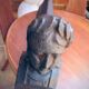 Pair of cast-iron chenet characters with laurels