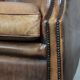 Club chair made of sheepskin leather finished with decorative nails