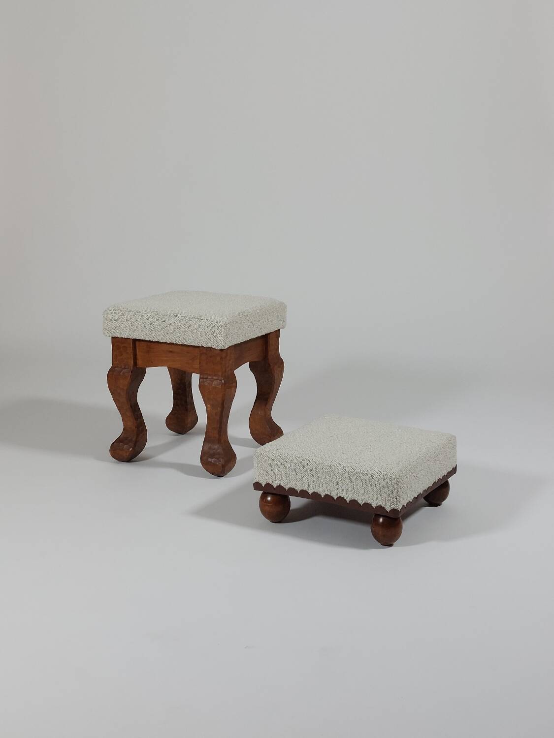 Unique sculpted stools, freshly upholstered and exquisite.