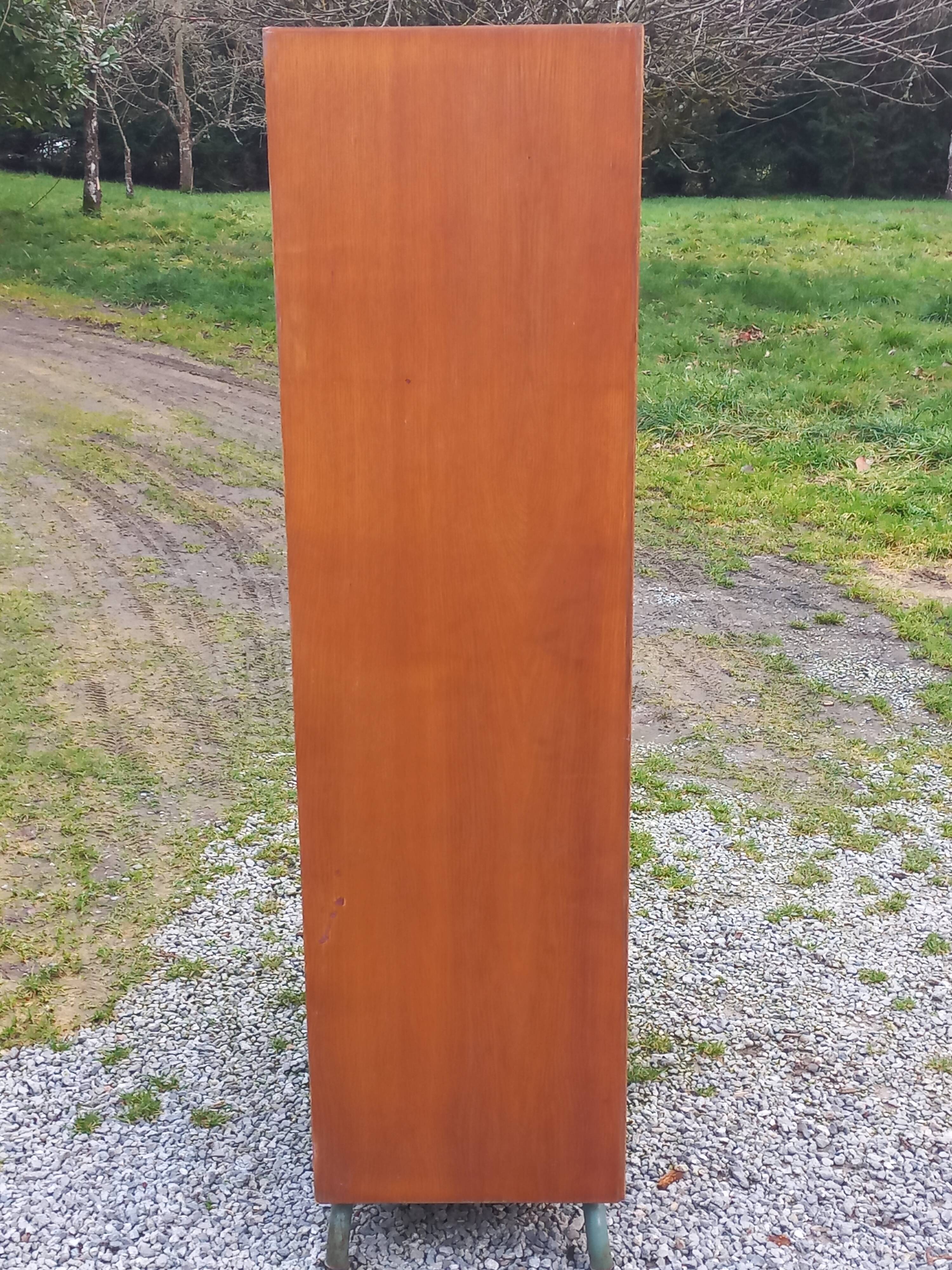 Vintage oak wardrobe with metal legs from the 1950s.