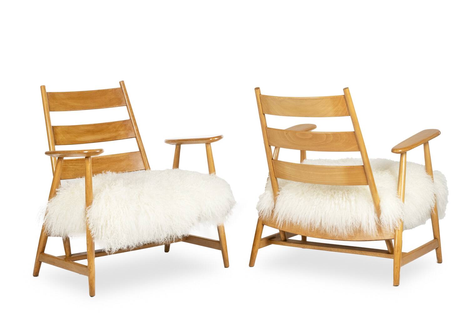 Pair of “lounge” armchairs in blond beech. 1950s