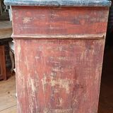 Antique piece of furniture with a grey patina.