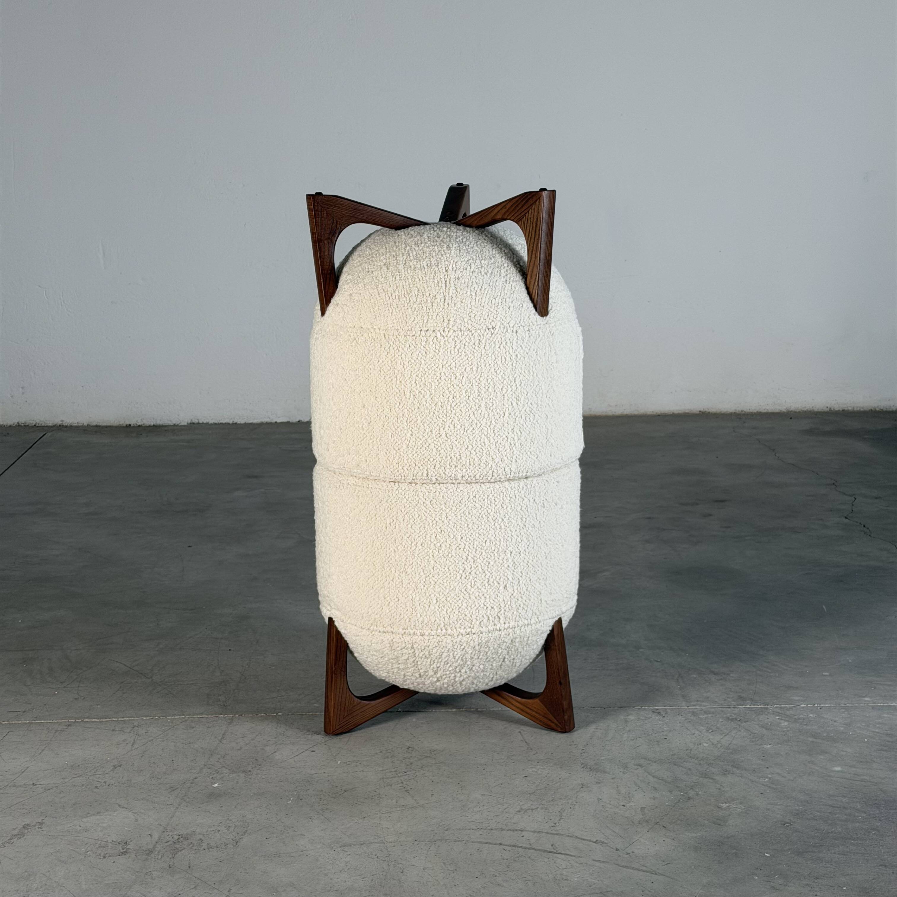 TOTEMO stools by FORME with ivory Dedar bouclé upholstery and walnut legs.