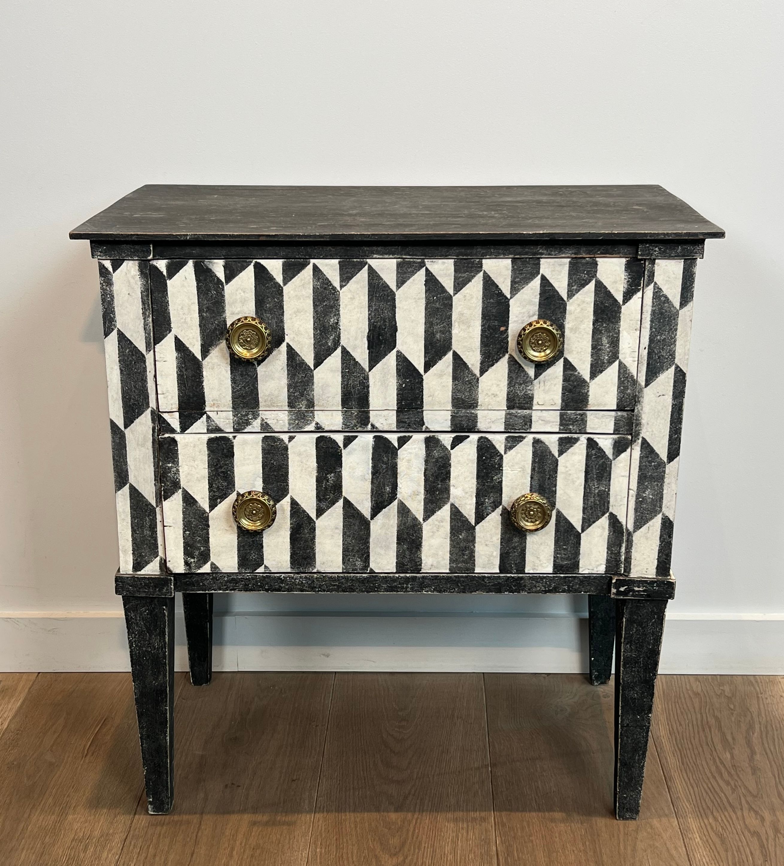 Small Italian chest of drawers with two drawers, patinated with a trompe-l'œil checkerboard pattern