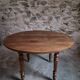 French antique round dining table in walnut, circa 1880–1900.