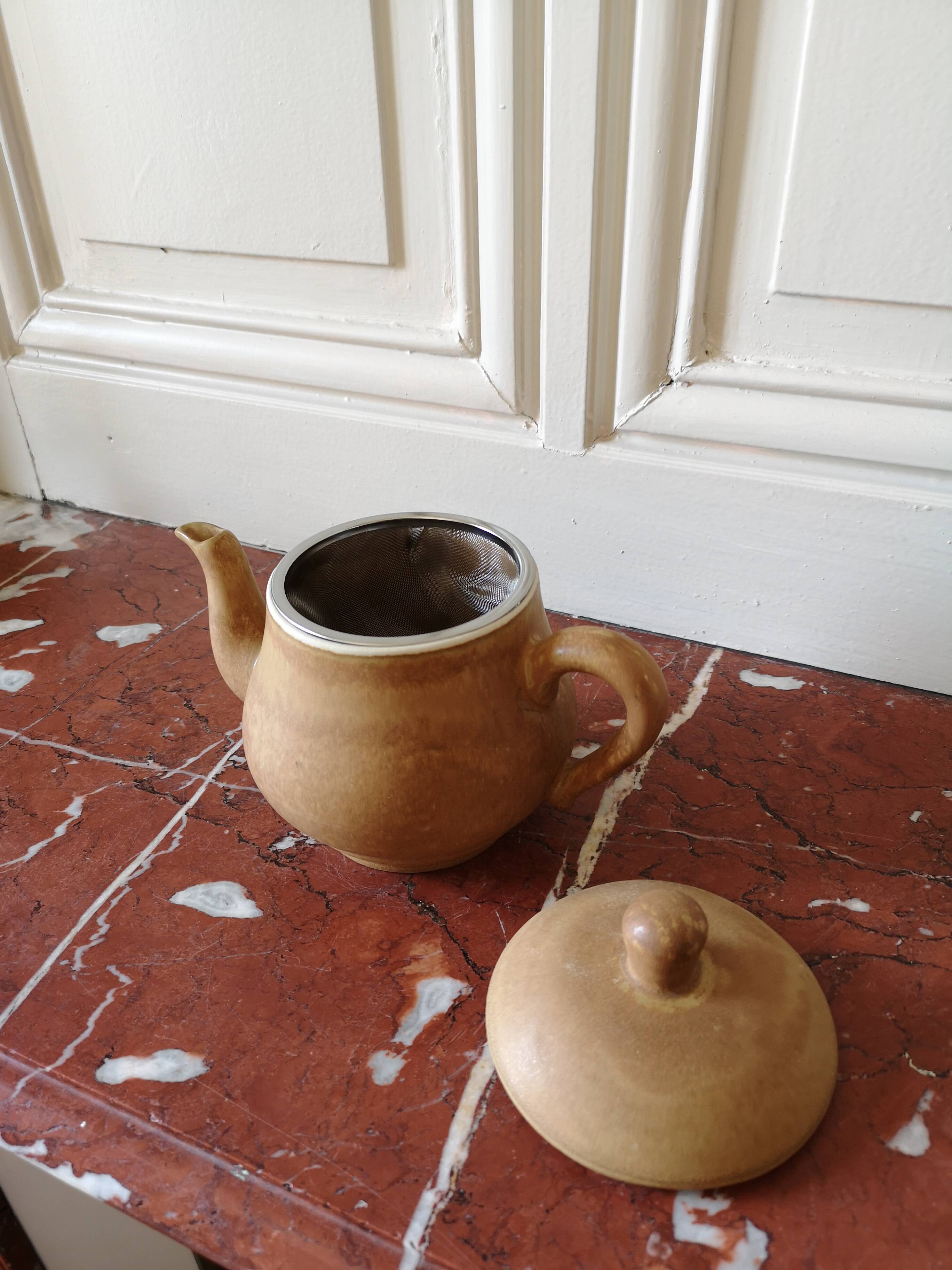 Vintage stoneware teapot and cup, "selfish" tea service, signed
