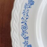 Round antique earthenware dish with floral decoration