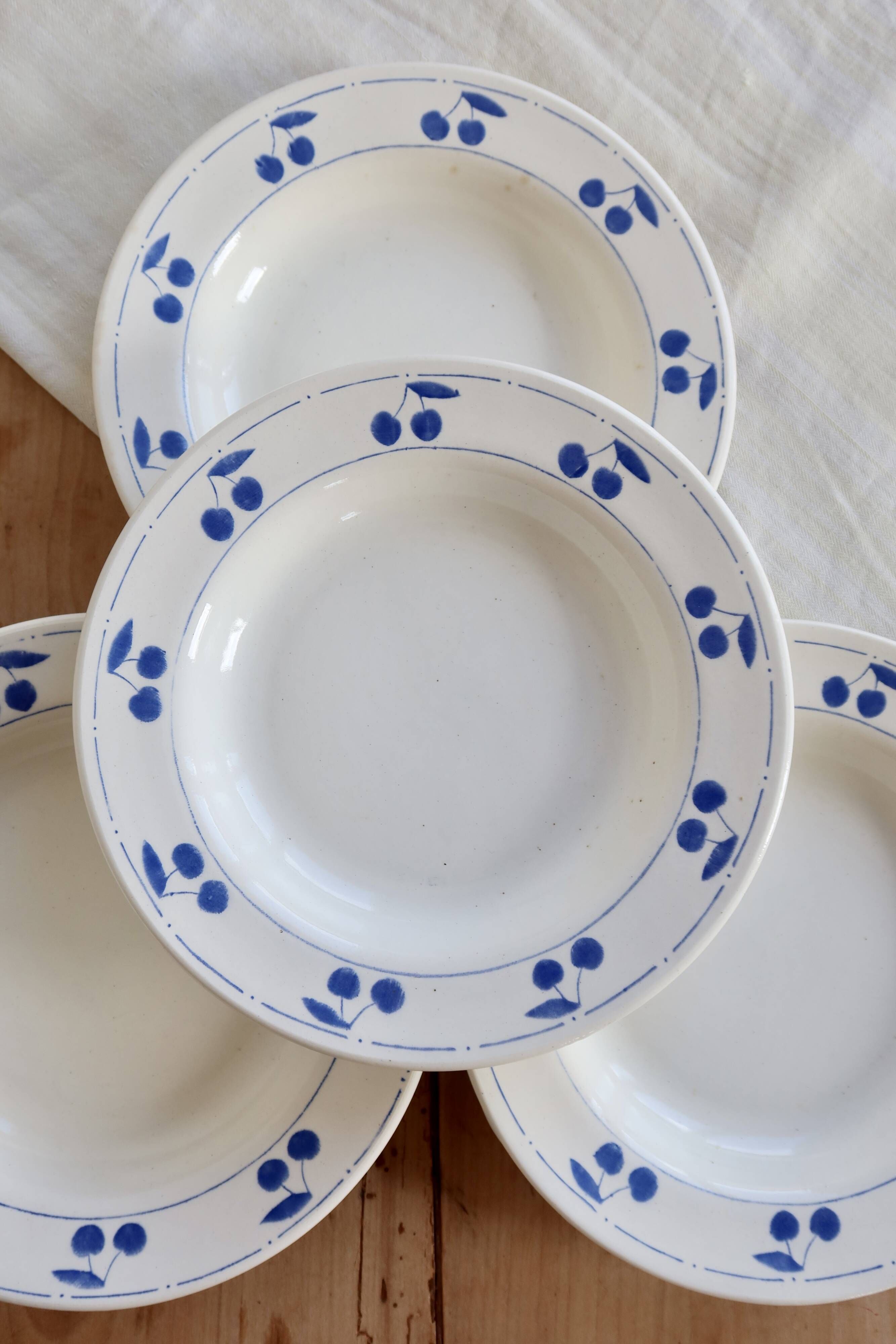 4 vintage deep plates in ivory earthenware with blue cherries