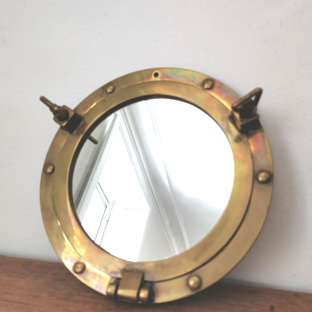 Brass window mirror 21cm diameter