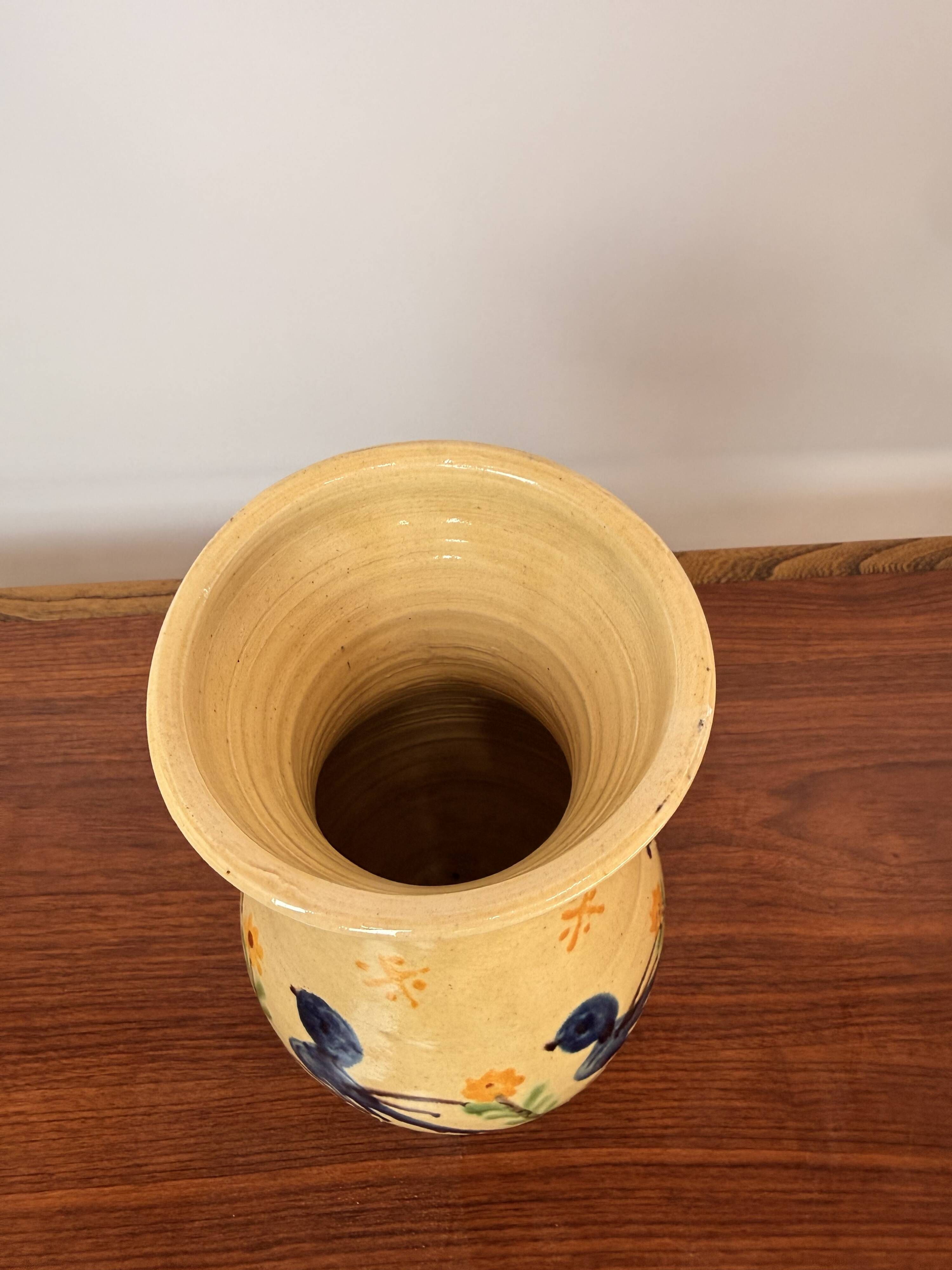 Large vase in glazed pottery decorated with blue birds and flowers.