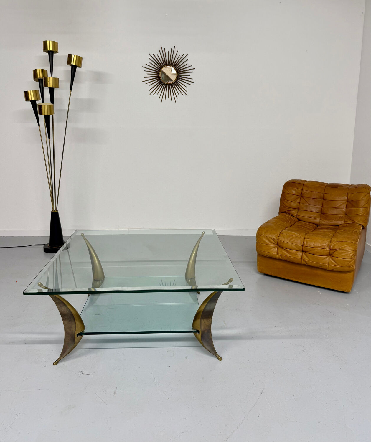 Glass coffee table with solid brass legs, Italian design from the 60s